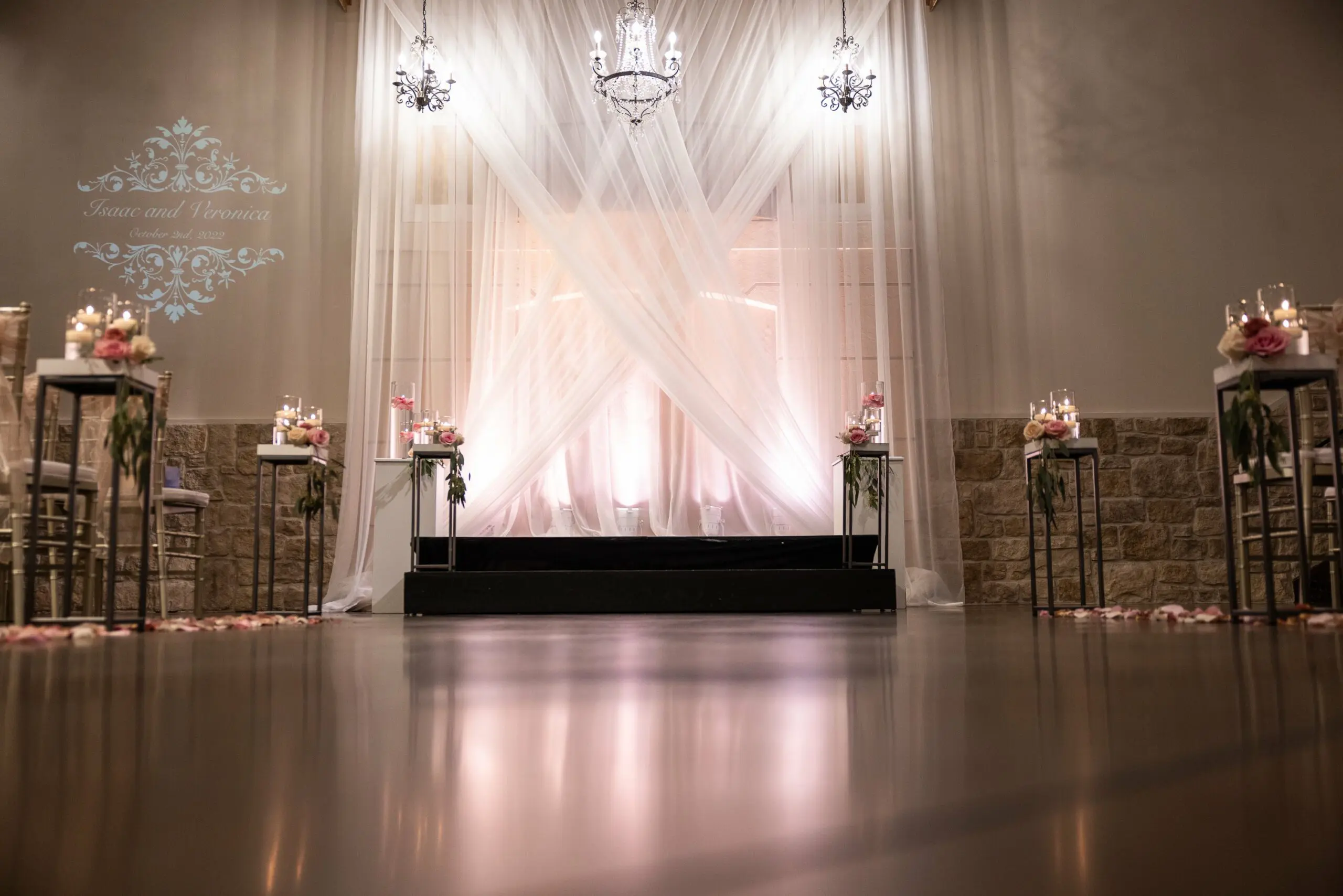 Affordable Wedding Venues Near me- Ceremony with Pink Lighting and flowers