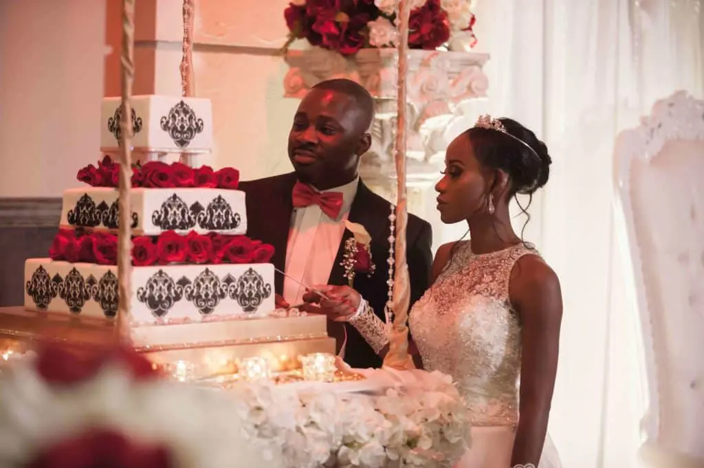 Wedding cake with red roses and black damask