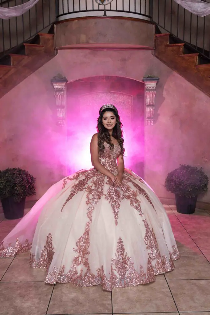 Girl in pink lighting at quinceañera venues near Denver