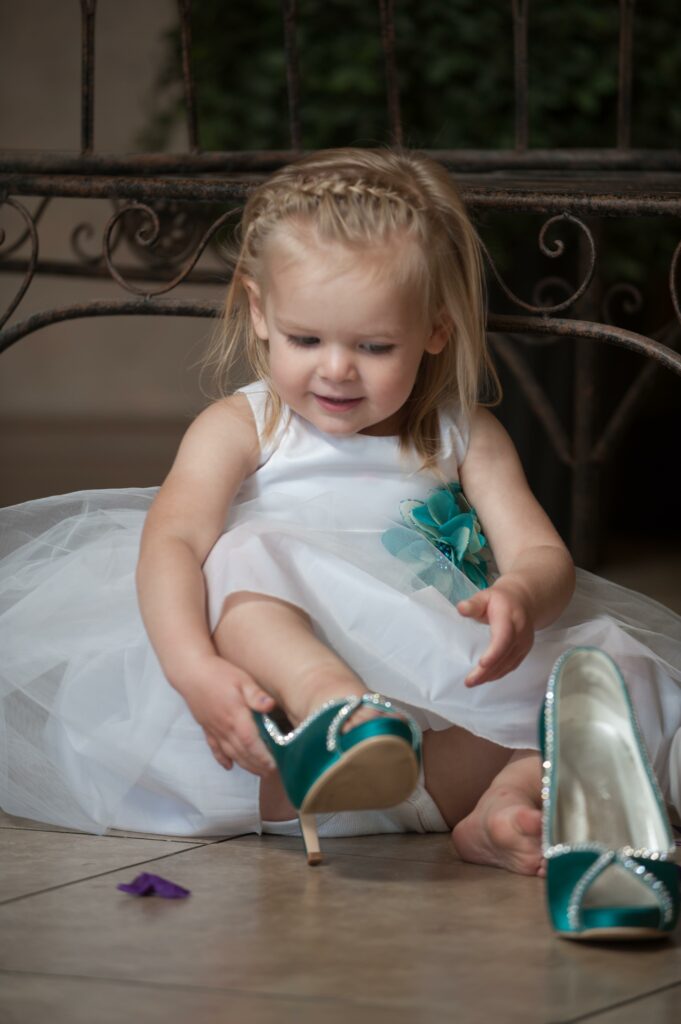 Flower girl with the bride's shoes