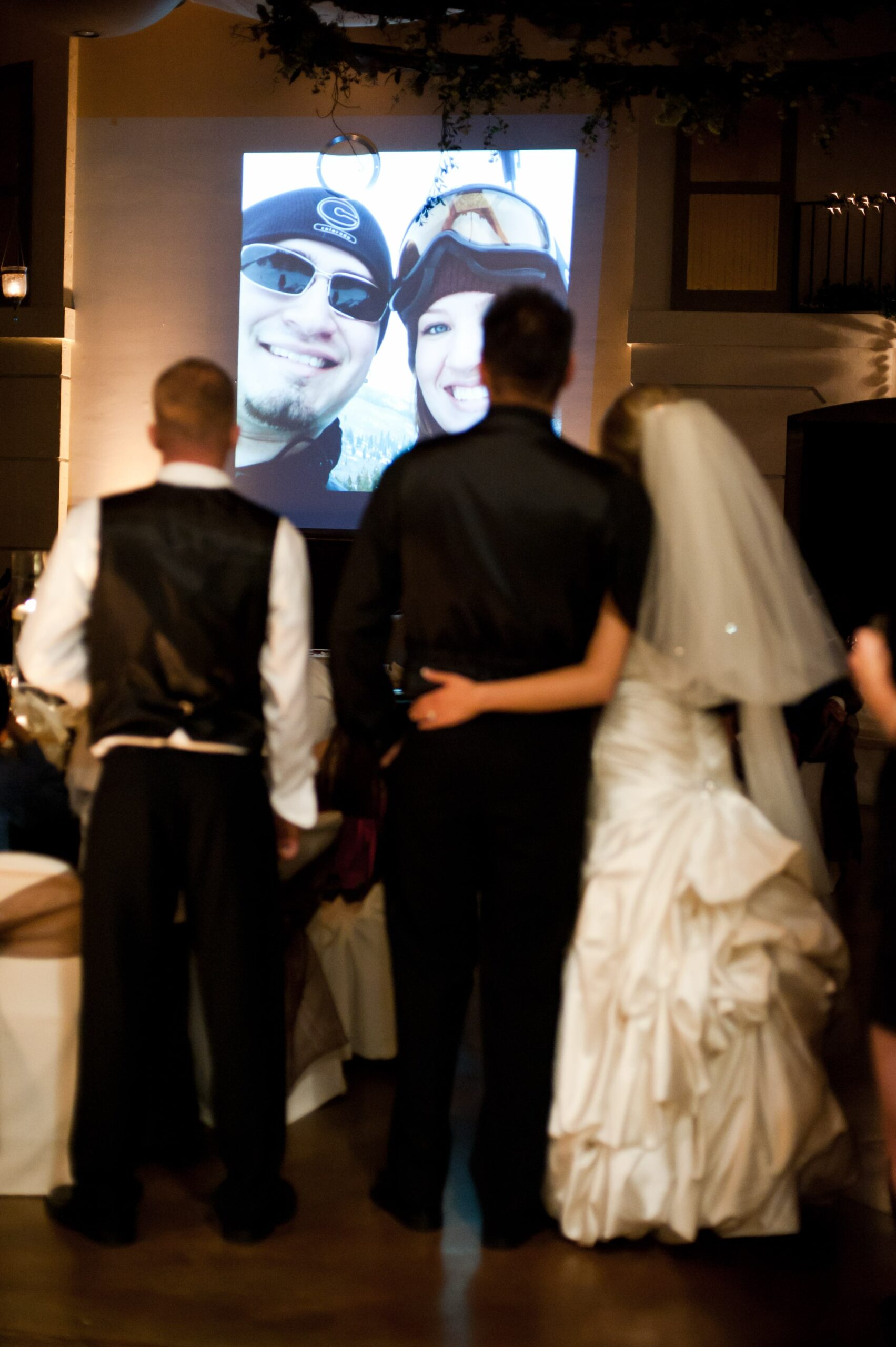Bride and groom watching slideshow