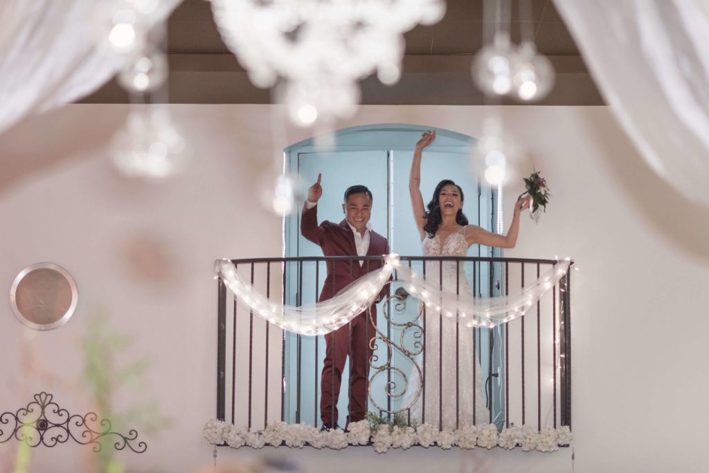 Bride and groom on walk-out balcony. Wedding venue. near me