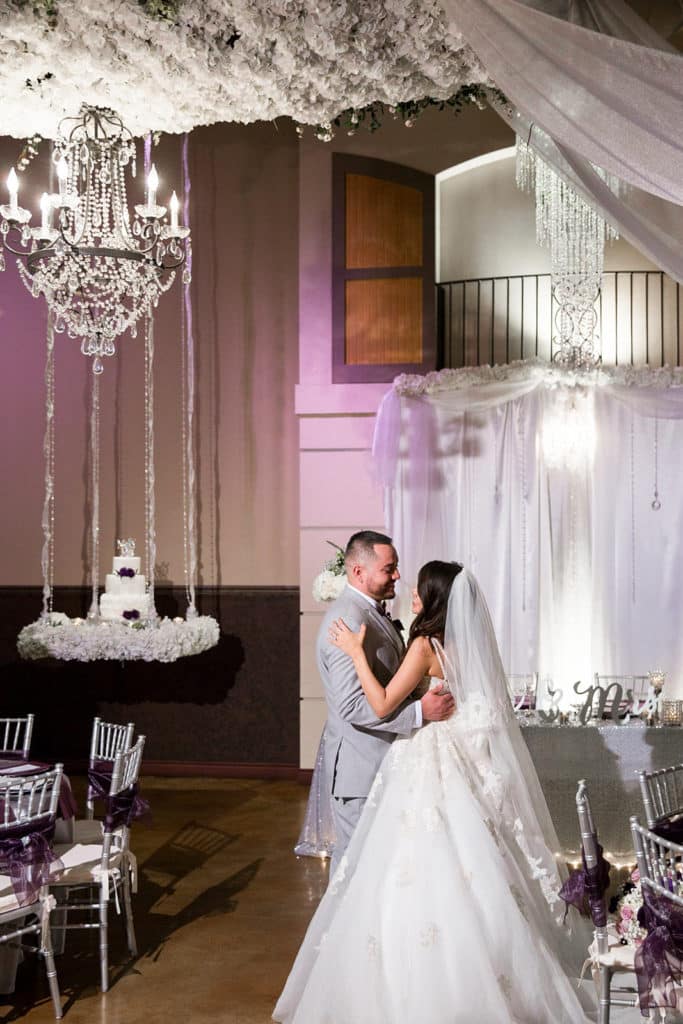 Hanging wedding cake with blue lighting