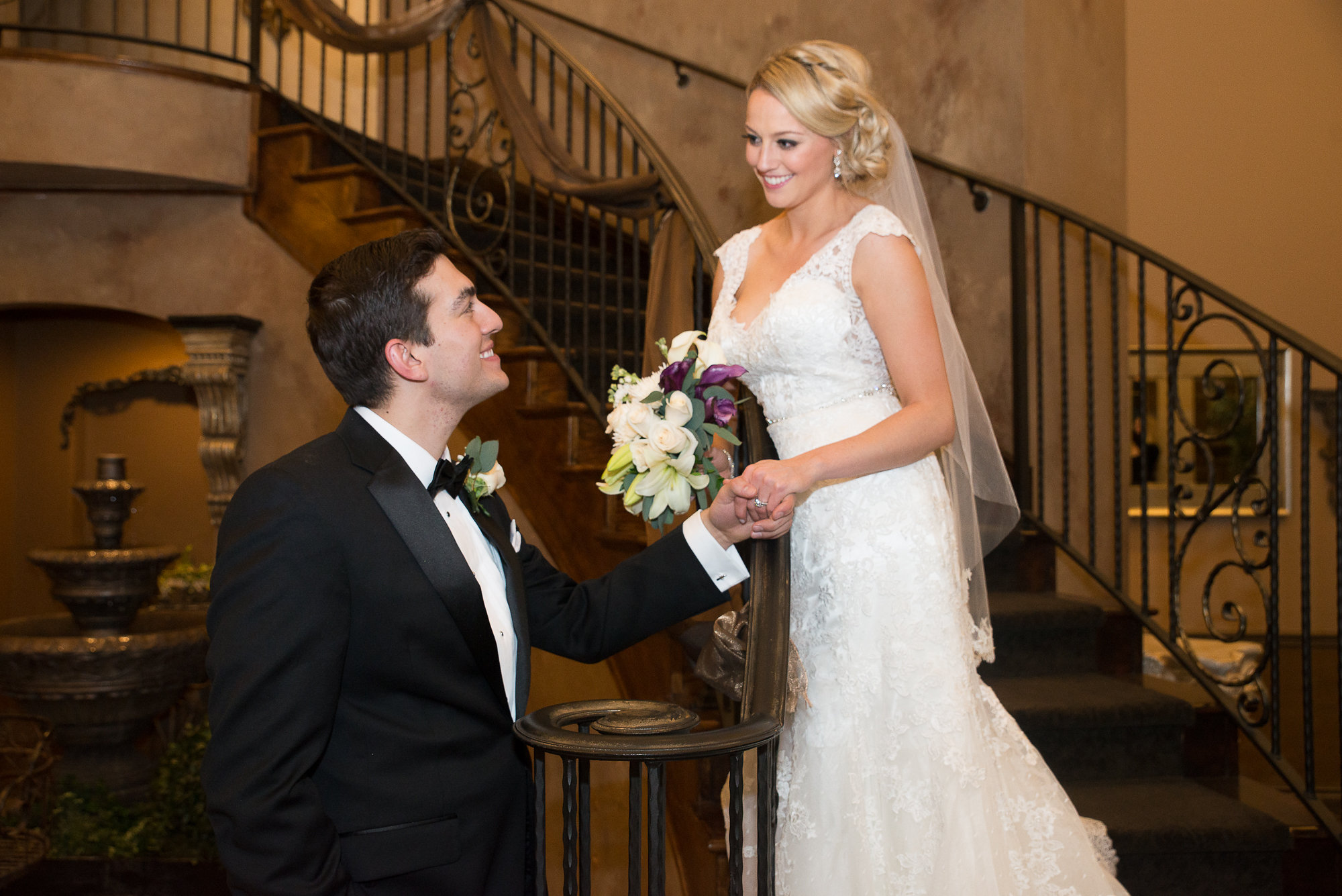 Beautiful bride and groom on grand staircase at Bella Sera Event Center