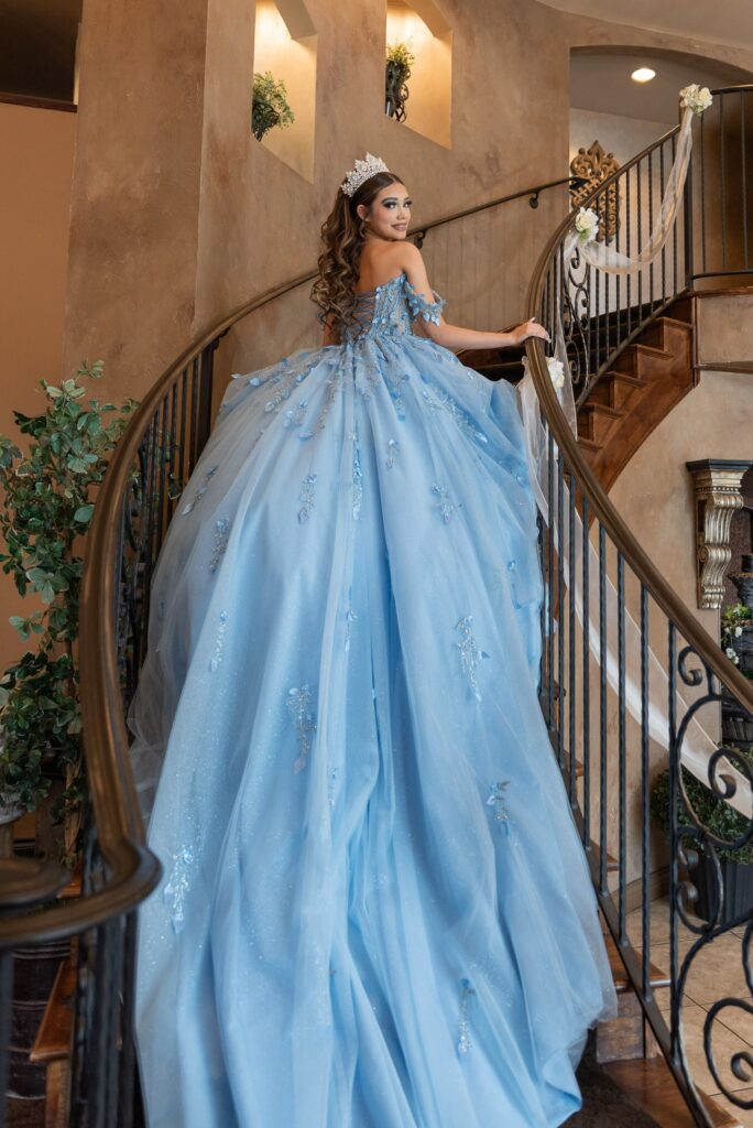 Quince dress with long train on staircase - Denver Quince venue