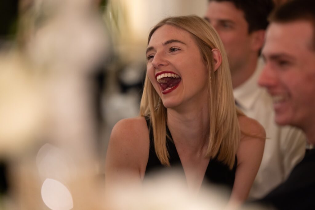 Wedding guests laughing