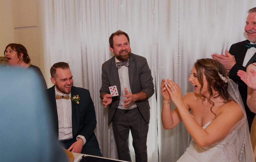 Bride & groom amazed at magician