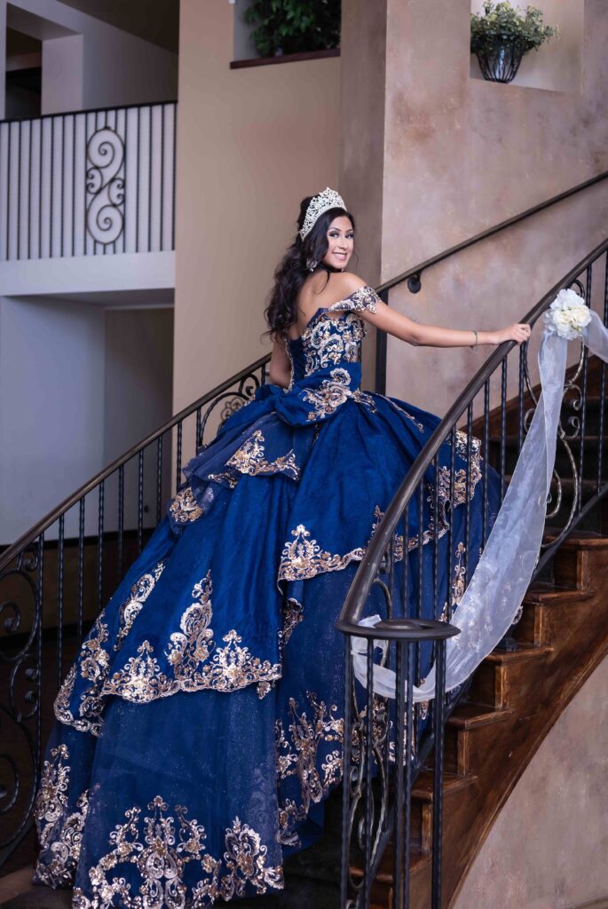 Navy blue quinceanera dress grand entrance on staircase