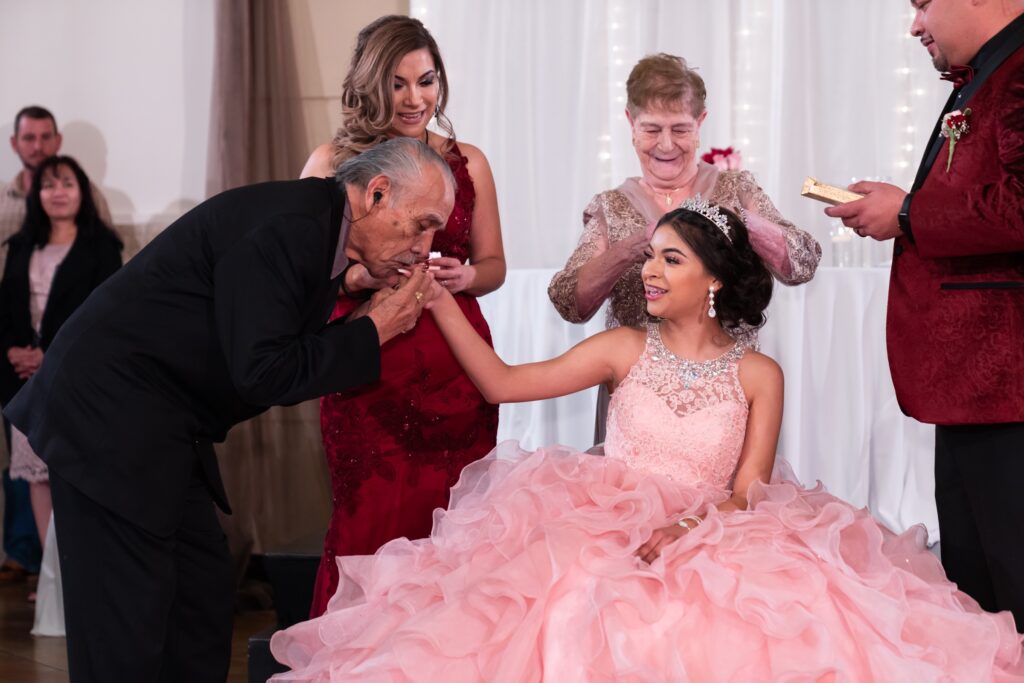 Quinceañera venues in Colorado grandpa kissing granddaughter