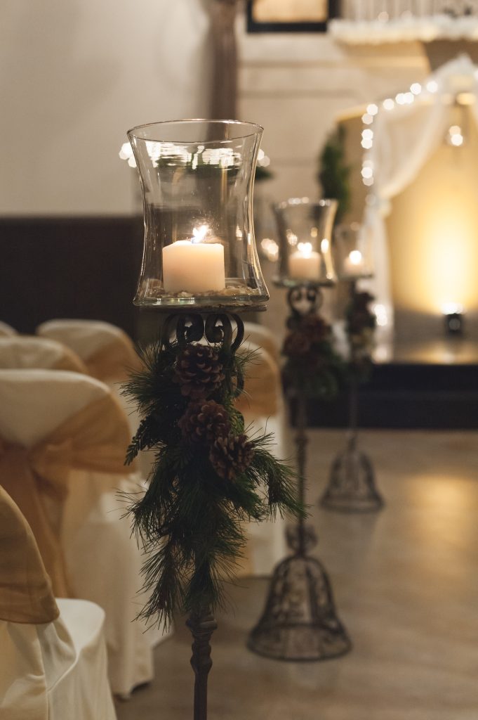 Winter rod iron centerpieces with evergreen and pine cones