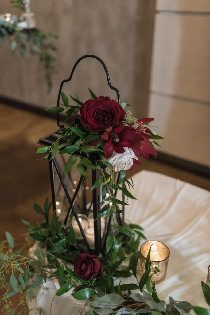 Winter wedding centerpiece Burgundy and greenery